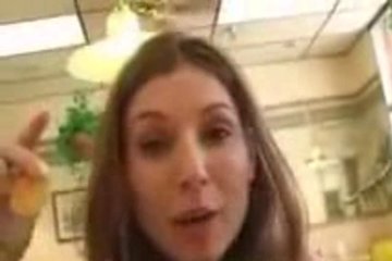 Busty brunette shows off her charms in a cafe