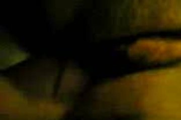 A girl listens to music, and a friend climbs into her cracks