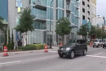 Tits and ass with clitoris showed in the middle of the city