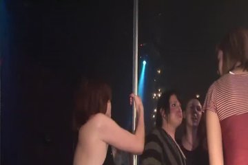 The chick danced near the pylon and showed her intimate places