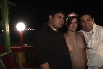 Naked, rural girl riding a bull