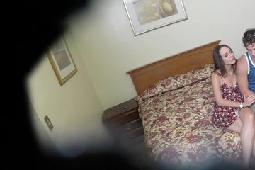 A guy fucks a pretty brunette in a hotel