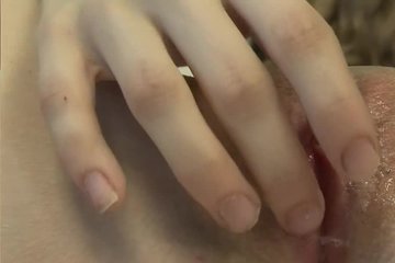 A satisfied girl gently smacks her pussy at her leisure