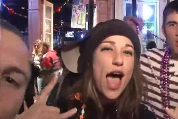 Girls are hung with beads and have fun