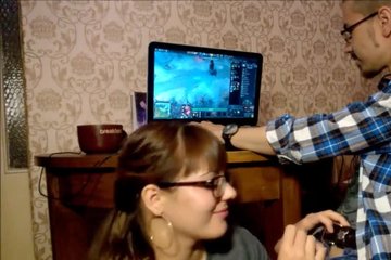 Wife sucks her husband's dick while he is playing at the computer