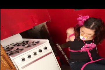 A tied bitch tries to untie the ropes