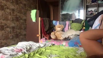 Fucks a Russian wife on the bed in front of the camera
