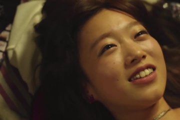 Tender sex of an Asian couple in love on the floor
