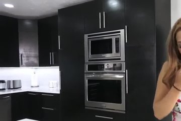 Cute girl sucks a guy's dick for a long time in the kitchen