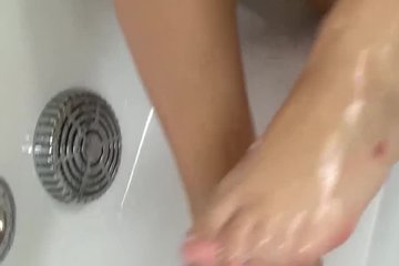 Lesbian couple enjoys licking each other in shower