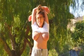 Big titted brunette  ella is displaying her milk jugs in a public place  during the day